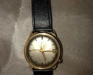 14 k gold accutron men’s watch