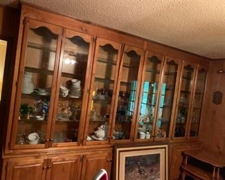 #18 built in cabinet w 16 doors glass and wood 138.5x18x8' tall, comes in 5 pieces total $200.00