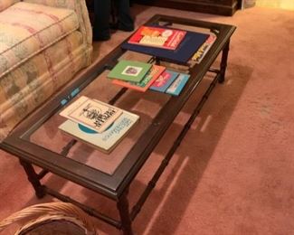 #56 coffee table w glass top 54x22x16 $30.00
