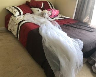 frat-boy bed. Wedding veil (probably) or mosquito net. You choose.