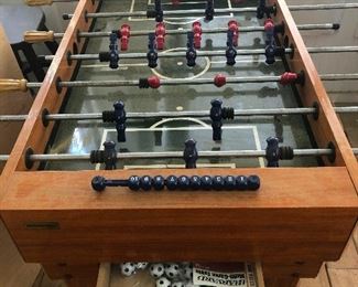 Foosball table with supply of balls