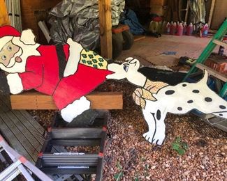 Dalmatian biting Santa's butt