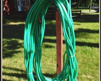 Two 100 Foot Garden Hoses.