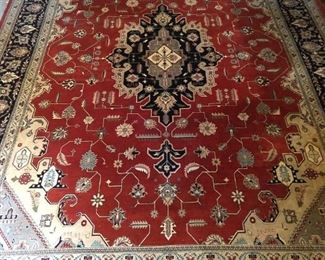 Persian design Heriz rug, hand woven, 100% wool face, measures 9' x 12'.