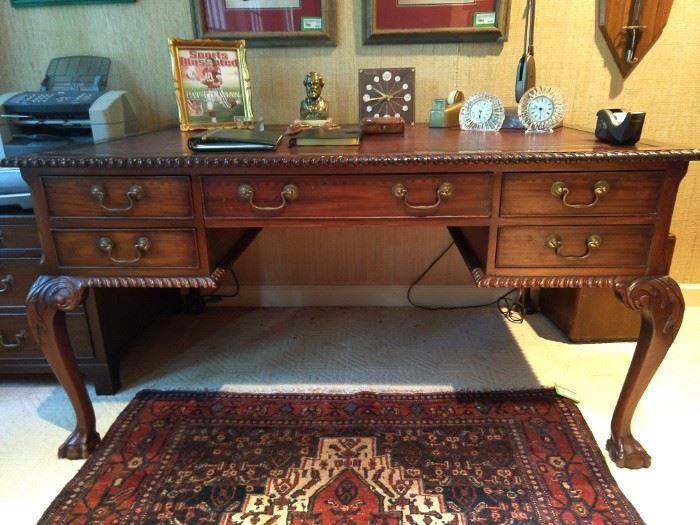 Vintage English mahogany partner's desk, with maroon tooled leather top.