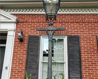 One of a pair of antique cast iron Scottish (Edinburgh) electrified gas lamps. The owner's Father bought these, while stationed at Ft. Benning.                                                   The city of Columbus, GA bought a large quantity of these Scottish gas street lamps when they switched to electric street lamps. The city then sold off the excess lamps and here are a couple of them!                                  They are approximately 12' tall.