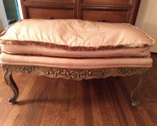Nicely carved wood French bench, with down cushions.