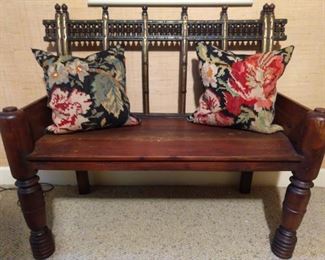Very cool wooden bench, with pair of floral kilim pillows.