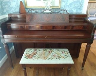"Arcosonic" spinet piano, by Baldwin, serial # 566822, dating it as produced in 1955, with hand needlework on matching bench.