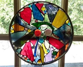 One of three round, stained glass artworks, by TN artist John Molthen.