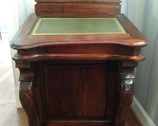 Small, vintage mahogany writing desk, with tooled leather top and eight side drawers.