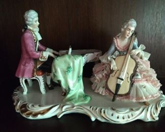 Such a fun, relaxed and loving couple, lounging about, strumming musical instruments.                                               You know those Dresden Art Germans can whoop up a fine porcelain figurine like no one else!