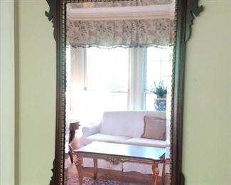 Very nicely detailed classic mahogany beveled glass wall mirror, by Henkel-Harris.