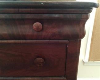 Detail of the beautiful mahogany wood on this chest.