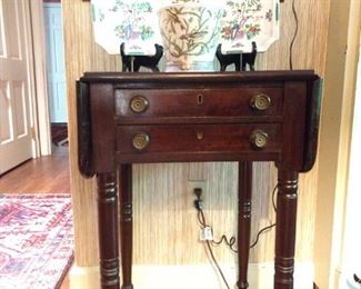 Very nice example of early American 2-drawer, drop-leaf mahogany side table.