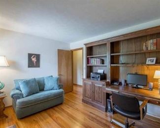 Office wall unit and green chair with hide-a-bed. Side table.