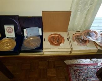 Collectible copper plates, NIB, with certificates; side table that matches dining room table (glass top).