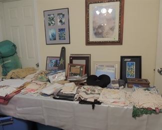 a tub of linens and lace items