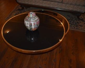 Gorgeous Art Deco Style Coffee Table. Table Swivels to make 2 round Glass Top Surfaces trimmed with Gold Colored Rims.