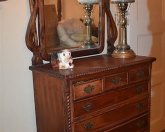 Gorgeously Carved Bedroom Suite featuring Barley Twist, Pie Crust Edging, Claw Feet, and More. Bedroom Suite consists of Mirrored 8 Drawer Dresser, Highly Carved 4 Poster Bed and 2 matching End Tables!!!
