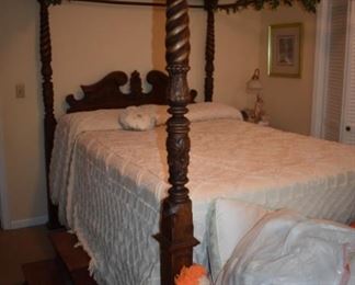 Gorgeously Carved Bedroom Suite featuring Barley Twist, Pie Crust Edging, Claw Feet, and More. Bedroom Suite consists of Mirrored 8 Drawer Dresser, Highly Carved 4 Poster Bed and 2 matching End Tables!!!