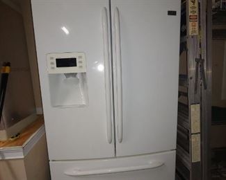 GE Profile Refrigerator with Cafe Doors & Bottom Freezer.