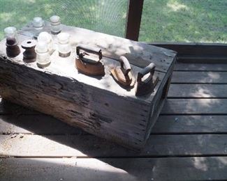 wood box with irons, insulators