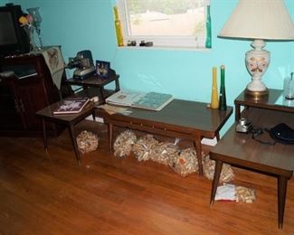 Mid century style coffee table and step tables.  Formica tops.  
