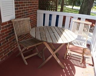 Sweet little wood patio table and chairs.  They all fold if you want to be able to use then tuck away in the garage.
