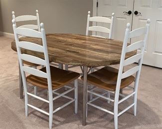 Oval table with chrome legs and 4 white and natural wood Ladder Back chairs (6 chairs in all)