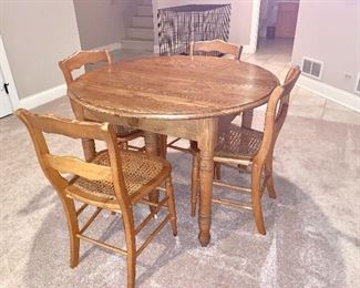 Vintage Round Oak table and 4 antique cane  seat chairs
