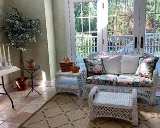 White wicker loveseat and matching table