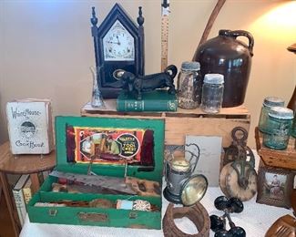  Vtg. mantle clock made in USA, cast iron Dachshund shoe scraper, brown crock jug. Vtg. Pully, Vtg. Ball jars w/lids blue and clear, Vtg. White House cookbook, Vtg. Gilbert tool box, Vtg. Delta railroad lantern, and more