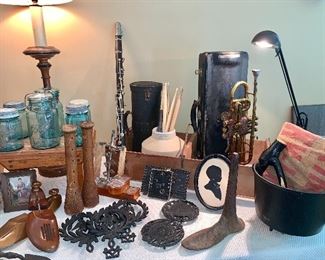  Vtg  Clarinet and  C G Conn  trumpet both  w/original cases, cast iron  shoe mold, wooden shoe inserts, wooden yarn spools, iron trivets, Vtg. lock plates, blue Ball jars w/lids
