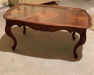 Vintage coffee table with glass top