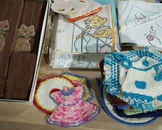 Vintage embroidered tablecloths, towels and crocheted pot holders