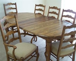 Dining room table with six chairs and two leaves