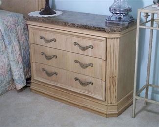 One of three matching drawer chests with marble top