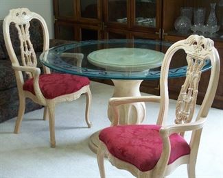 Pedestal table and carved wooden chairs