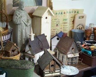 Birdhouse collection, concrete statue, garden tools