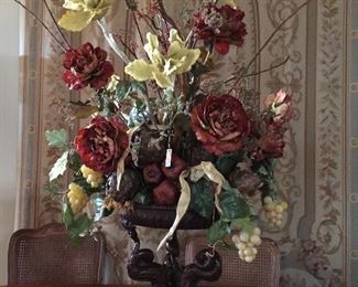 Stunning floral arrangement in heavy iron planter.