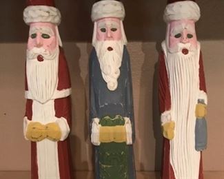3 carved wooden Santas