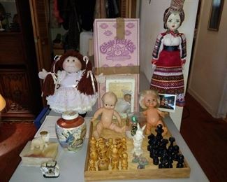 Cabbage Patch doll, Kewpie Doll, Russian doll, hand carved wooden chess set in box