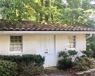 Mediterranean terra cotta roof tiles &  possibly the cinderblock shed 