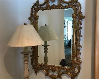  There are a pair of these ornate mirrors 