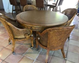  Game table with four cane seat chairs 