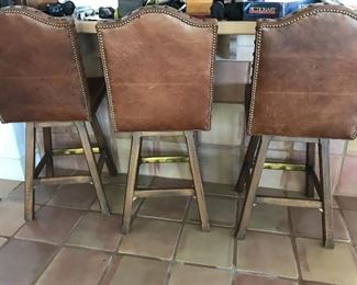  Five leather swivel barstools from Horchow