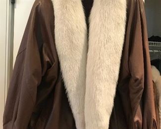 Brown leather jacket with white fox fur trim