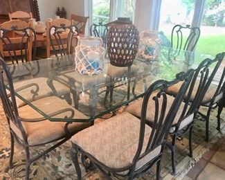 Glass top table with iron base & 8 chairs by Carson 