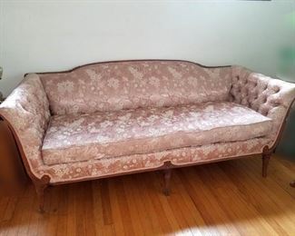 Vintage Hollywood Regency style sofa. Carved wood